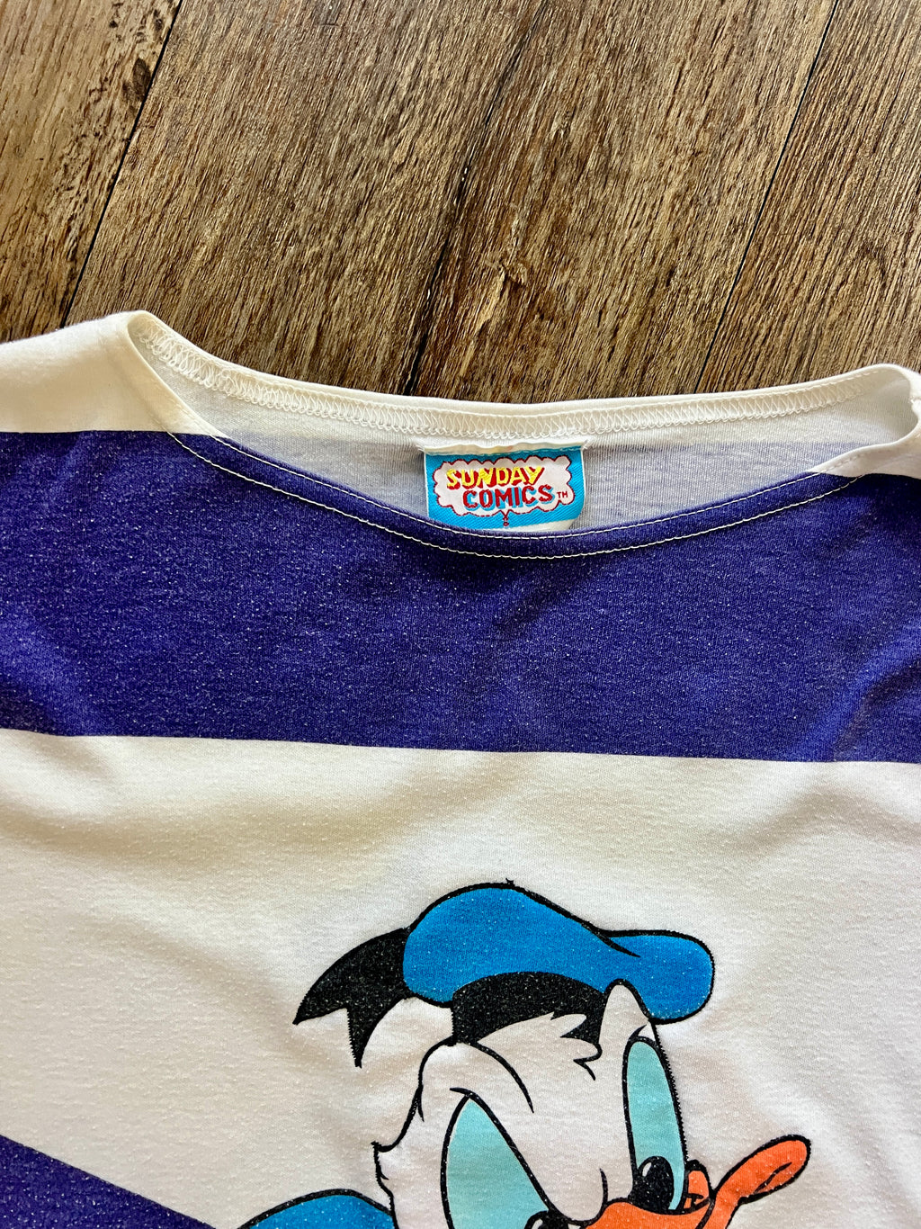 870 -White & Blue Donald Duck Climbing Through Stripes Shirt - M