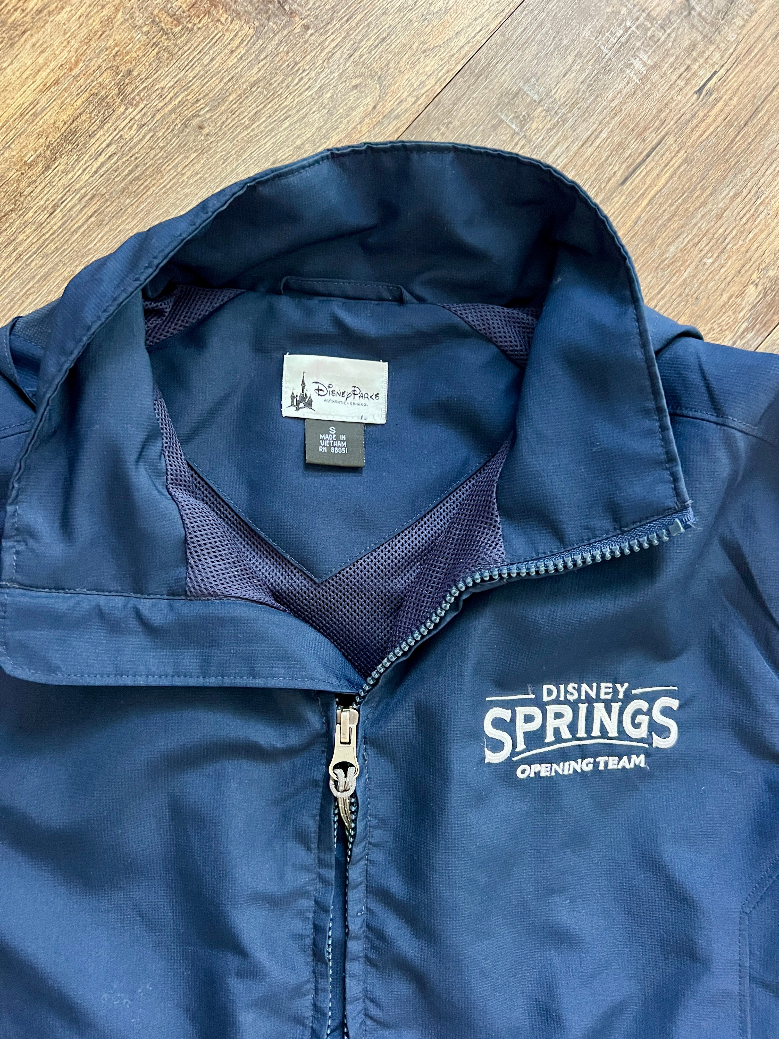 1316 - Navy Disney Springs Opening Team Zip Up Collapsible Hood Windbreaker - S