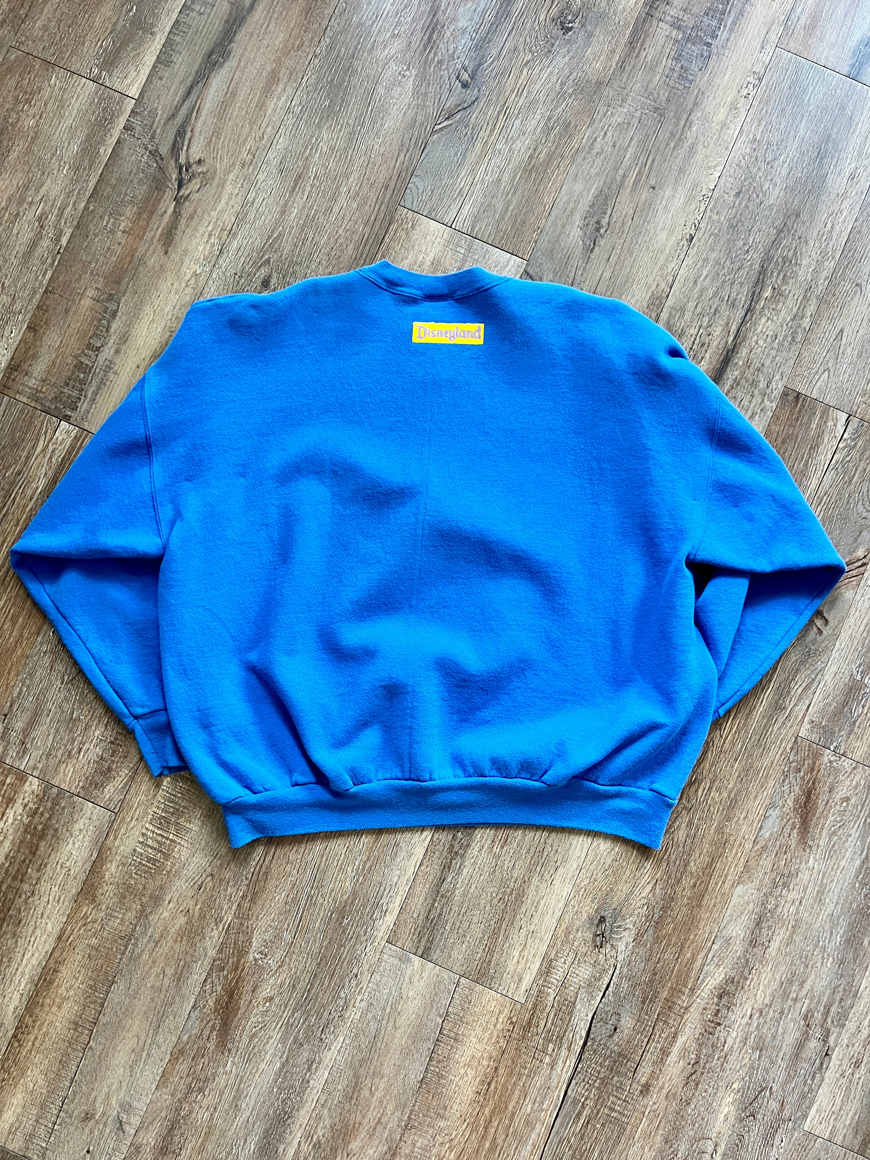 1083 -Blue Angry Donald Scratching Head Disneyland Crewneck - NT / XL
