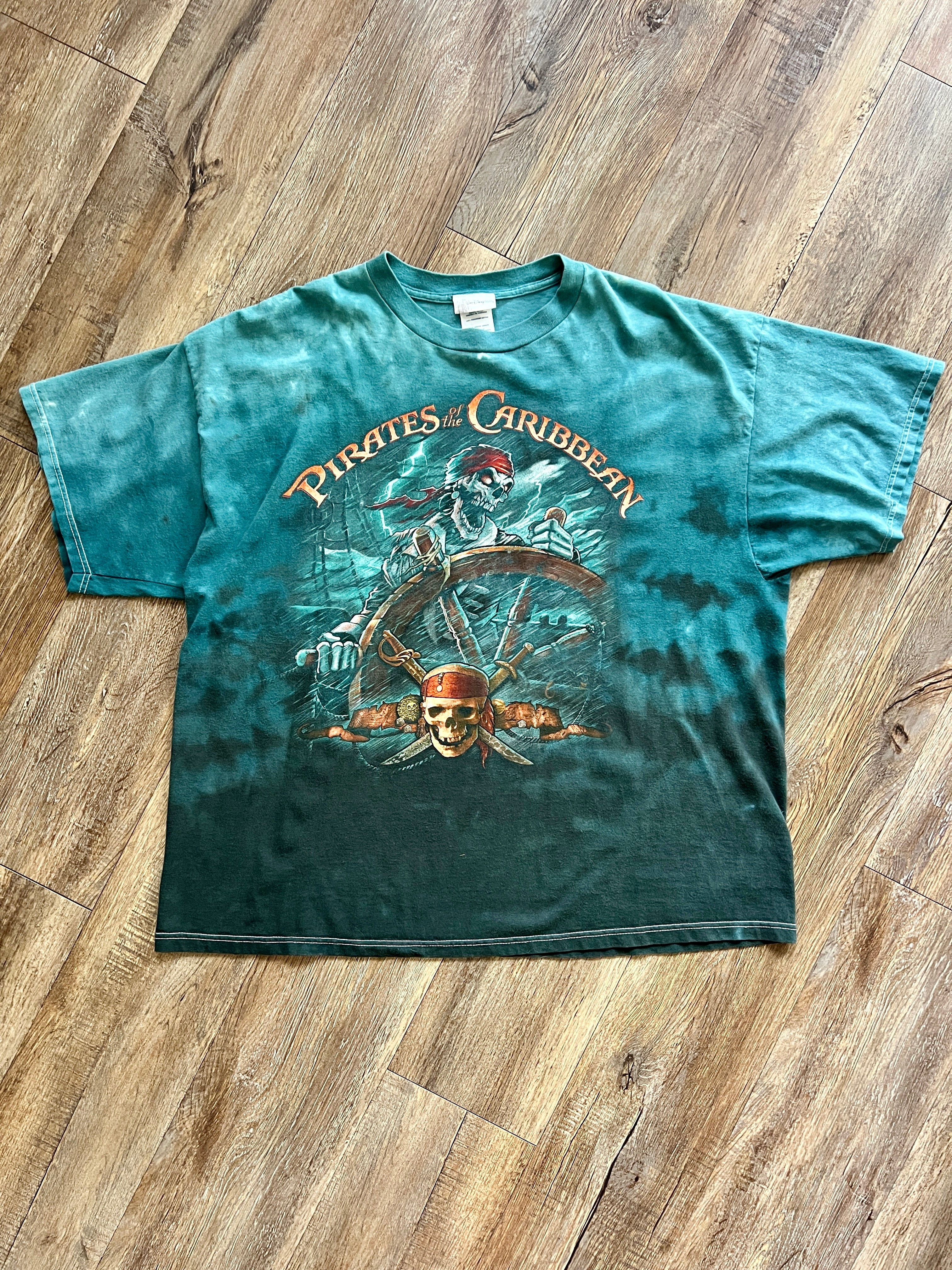 1086 -Teal Tie-Dye Pirates of the Caribbean Skeleton Sailor Steering Ship with Skull & Sword Shirt - 2XL