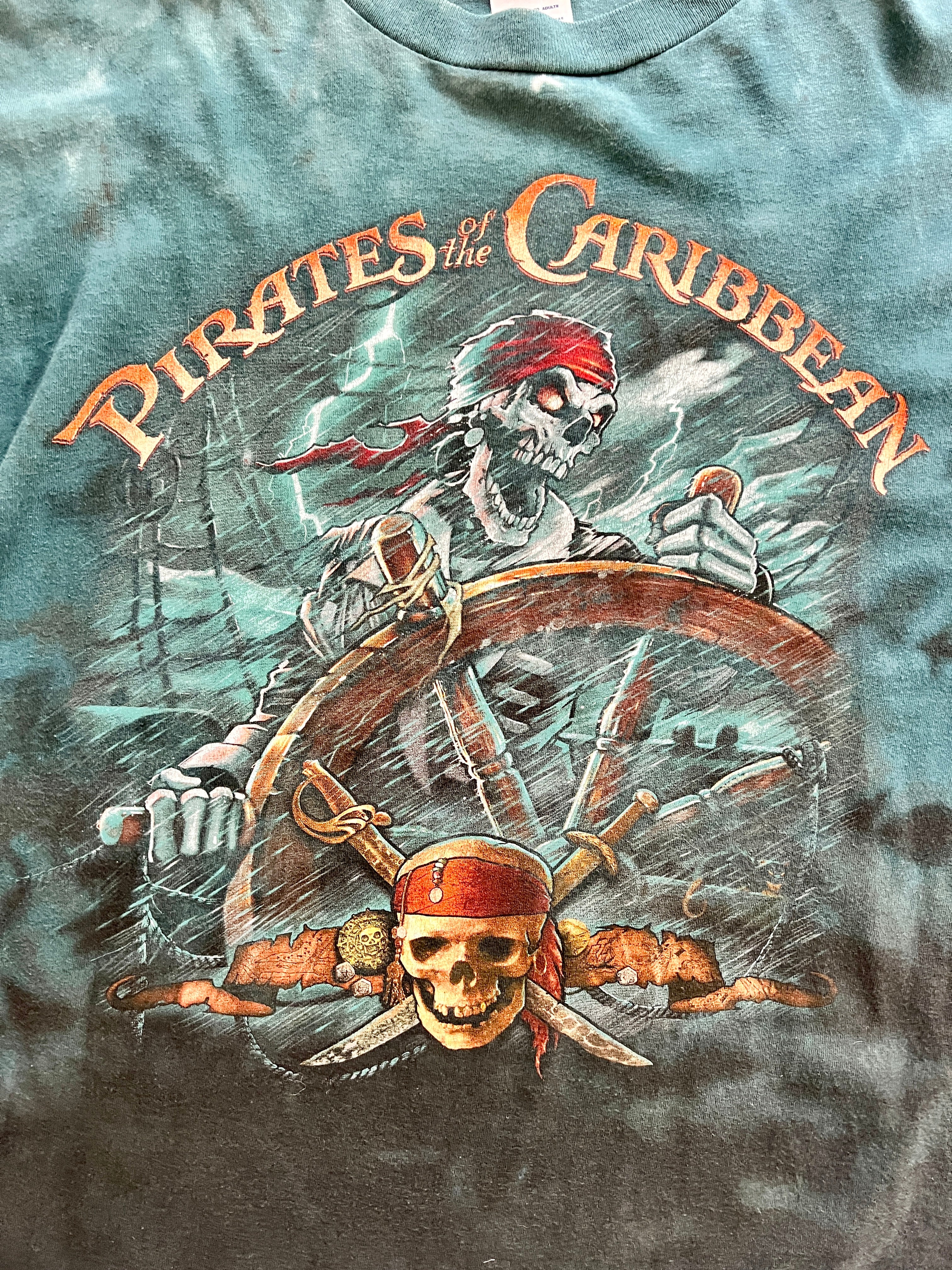 1086 -Teal Tie-Dye Pirates of the Caribbean Skeleton Sailor Steering Ship with Skull & Sword Shirt - 2XL