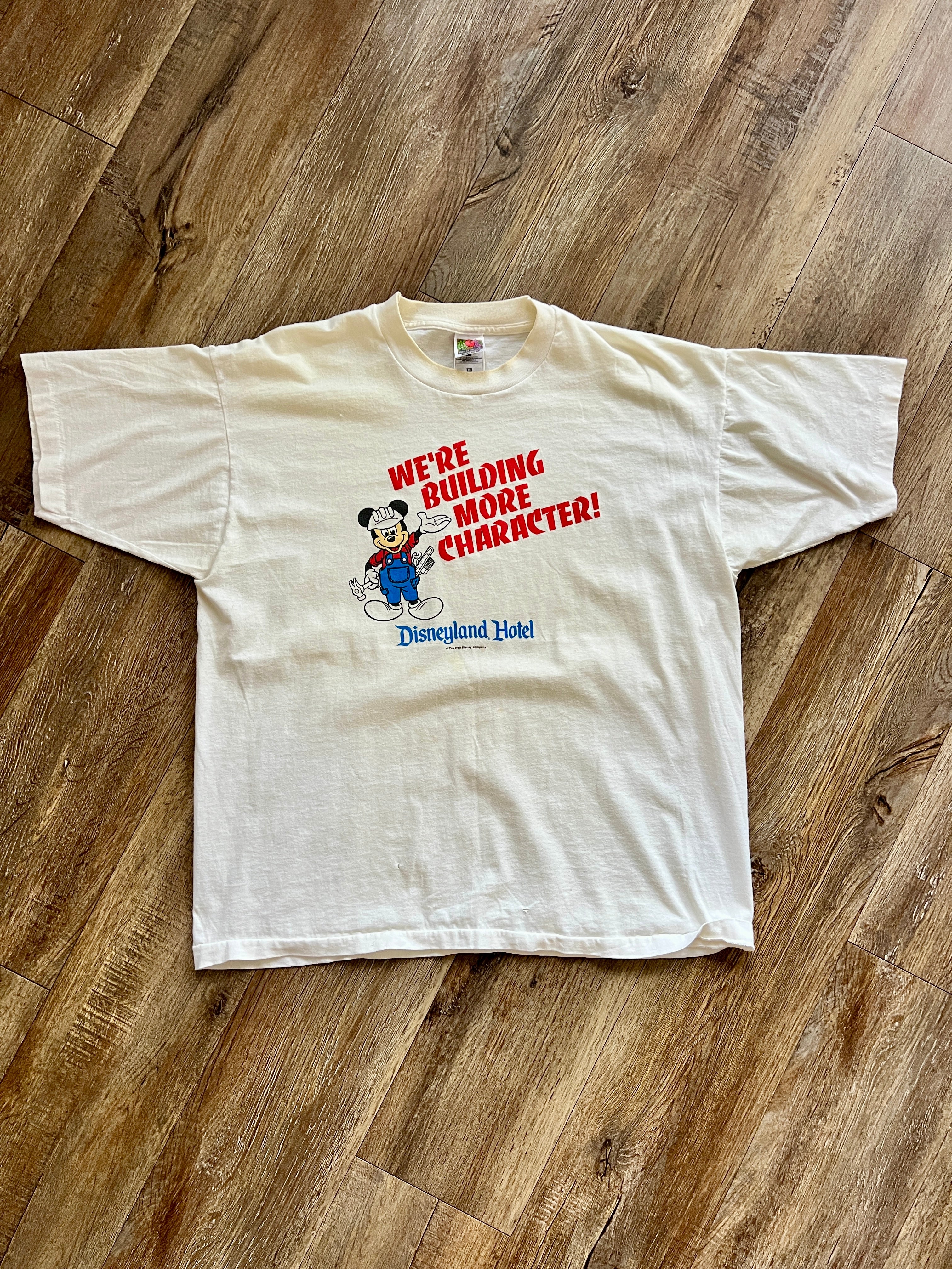 1096 -White Disneyland Hotel We're Building Character Construction Mickey Shirt - XL