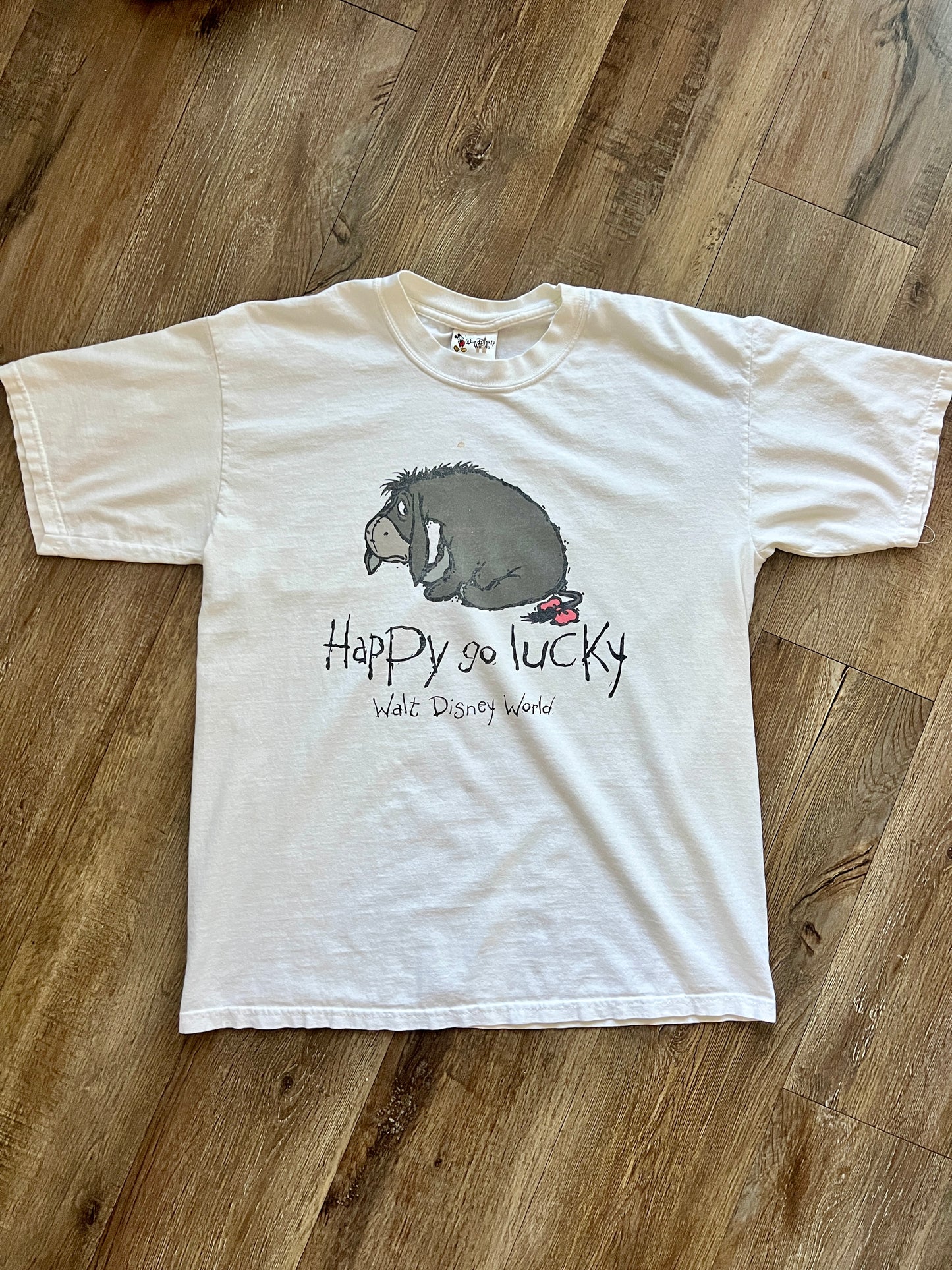 599 -White Eeyore Happy Go Lucky WDW Logo Tee - M