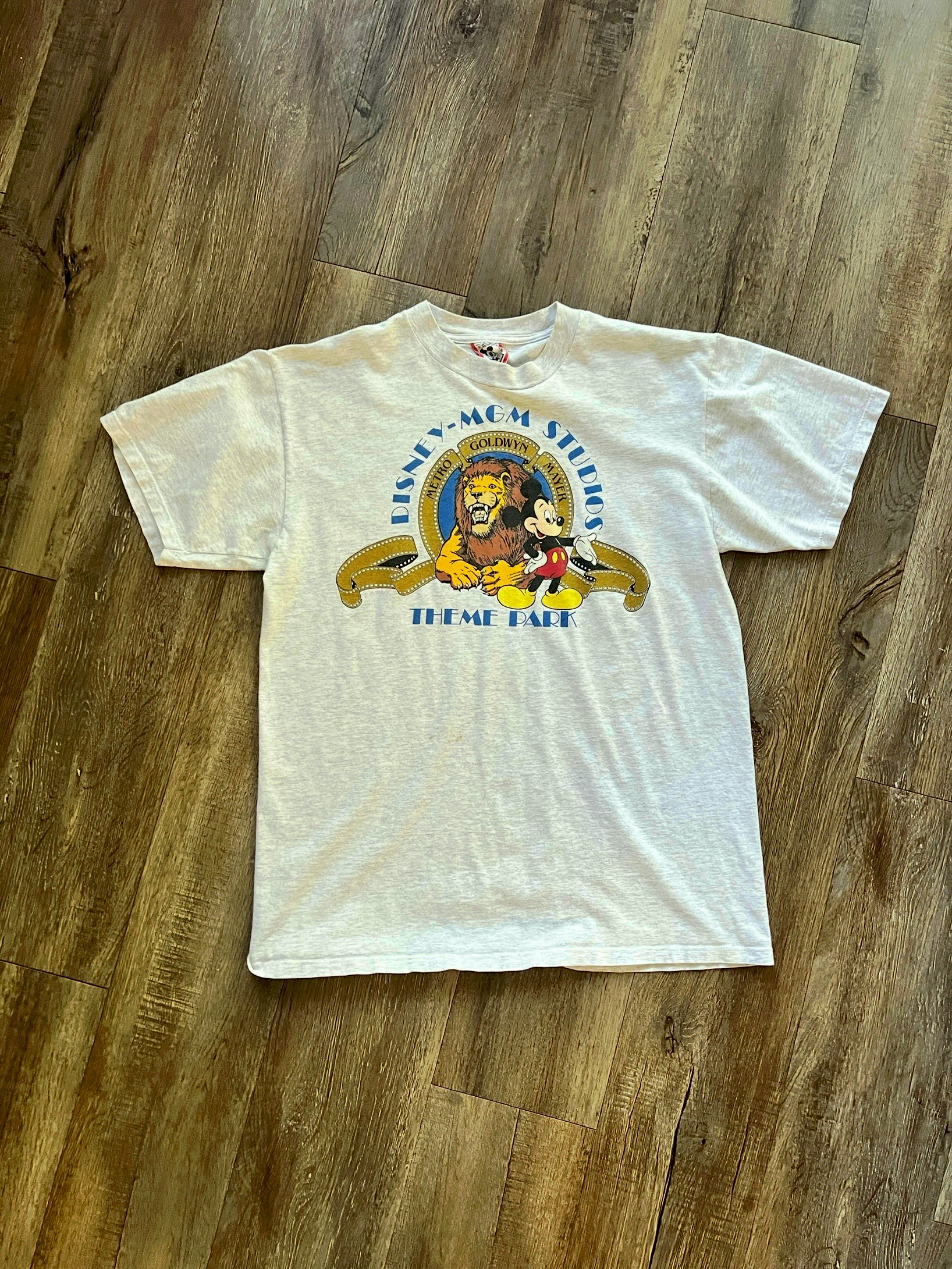 631 - Heather Grey MGM Studios Theme Park Logo & Mckey Tee - L