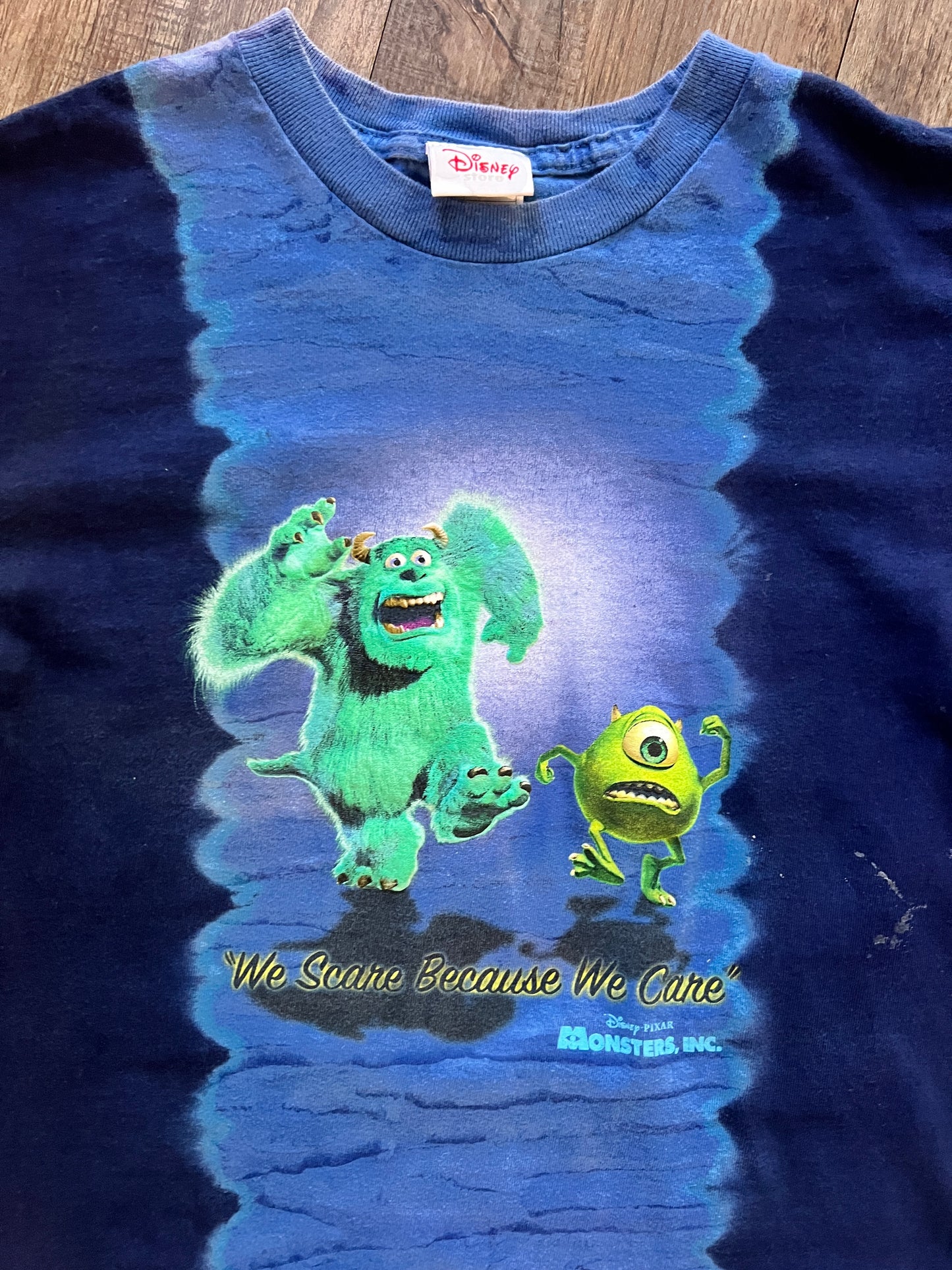 675 -Blue Tie-Dye Monsters Inc We Scare Because We Care Tee
