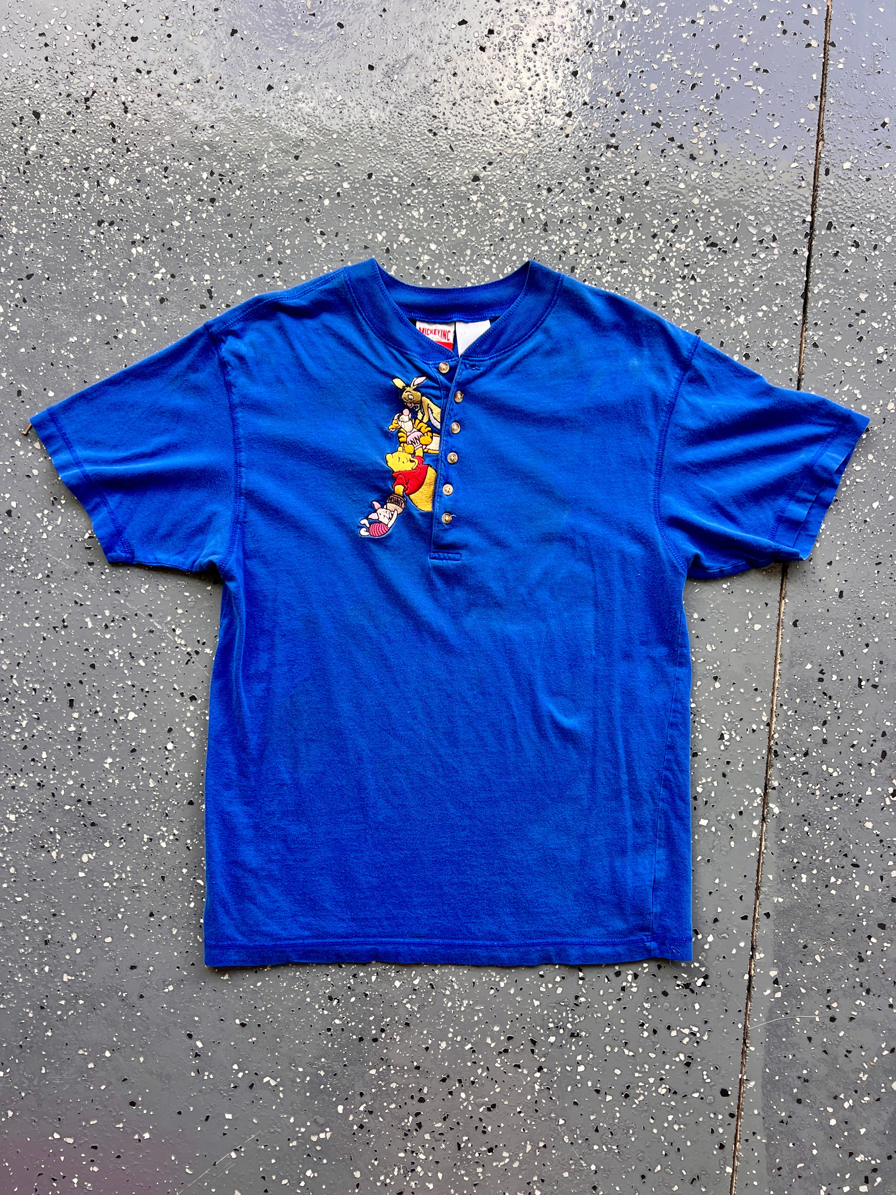 1437 - Blue Embroidered Hundred Acre Wood Swinging Piglet Henley - M